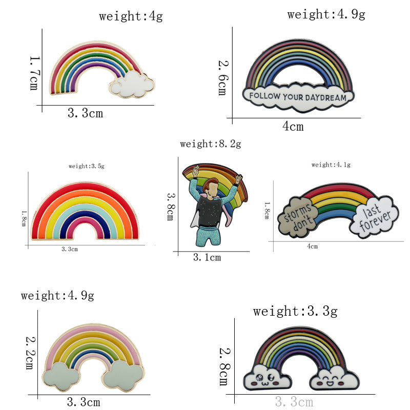Multiple rainbow bridge metal brooch designs with clouds, including “FOLLOW YOUR DAYDREAM”