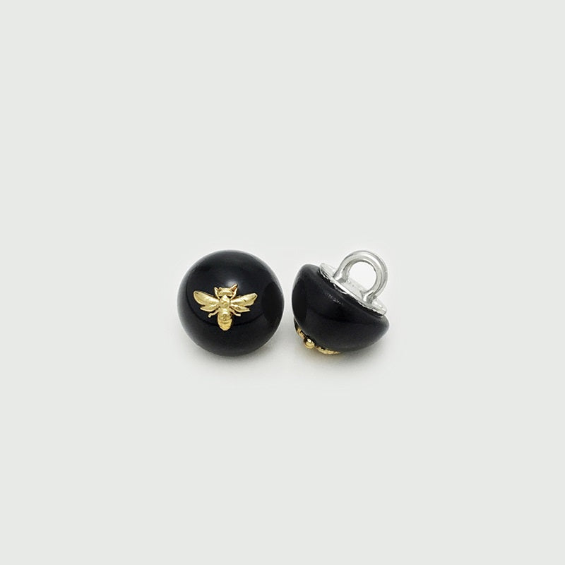 11mm black pearl bee button with gold-tone bee motif and loop, front view