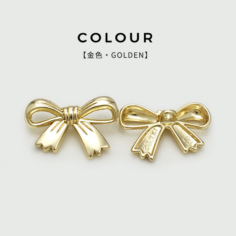 Gold bow metal buttons with shank, hollow, embossed back, hand-sewn