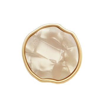 Irregular apple-shaped metal shank button, cream front with gold-tone rim