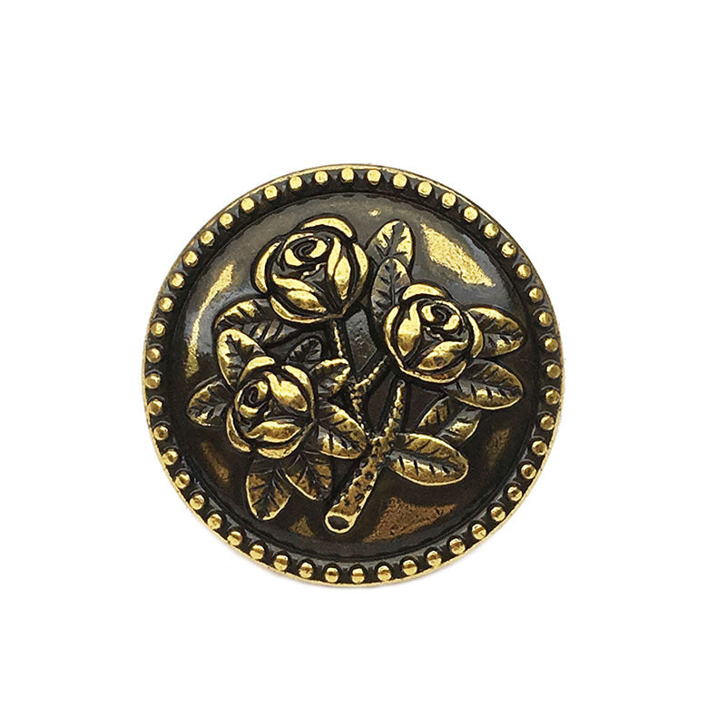 Vintage round rose metal button, black bronze with gold rose relief, front view