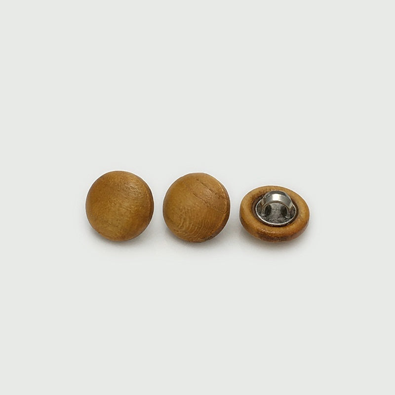 Wooden mushroom buttons in golden brown tones with metal shank backs