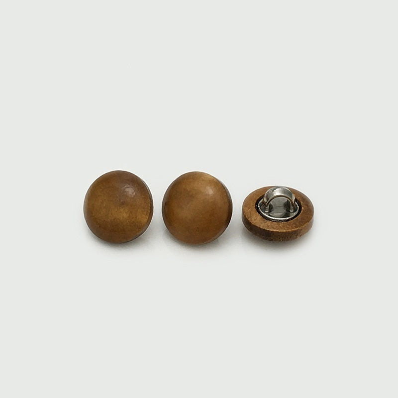 Wooden mushroom buttons in warm brown tones, metal shank showing on back