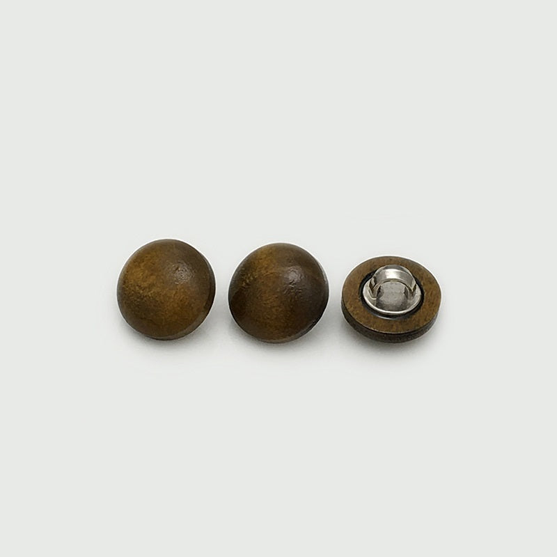 Wooden mushroom buttons in dark brown/olive tones with metal shank backs