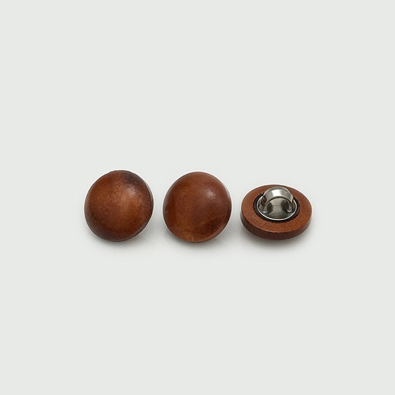 Wooden mushroom buttons in medium to dark brown tones with metal shank backs