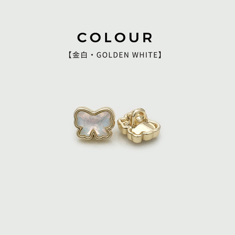 11mm bow metal shank button, golden white face with gold base (front + back)