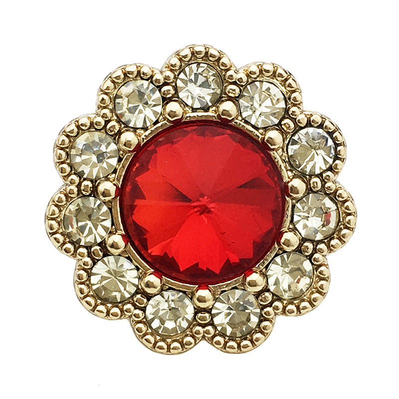 Red crystal floral shank button with gold-tone rhinestone border