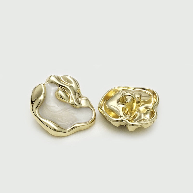 Irregular gold metal button: front and back with loop shank