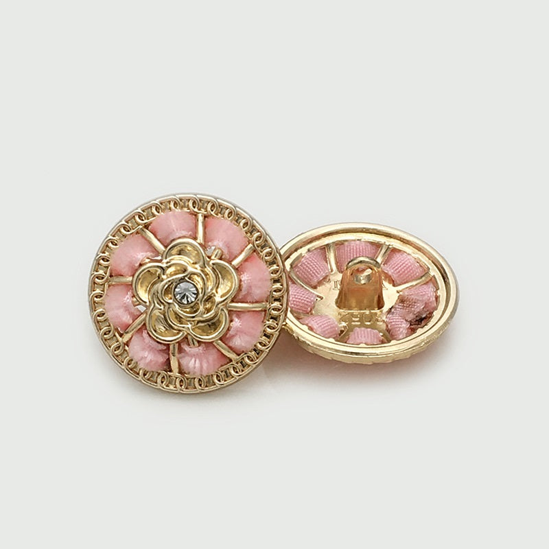 Round pink floral gold metal button, ornate filigree and central rhinestone detail