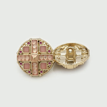 Round pink-gold metal shank button, cross rhinestone pattern, back visible