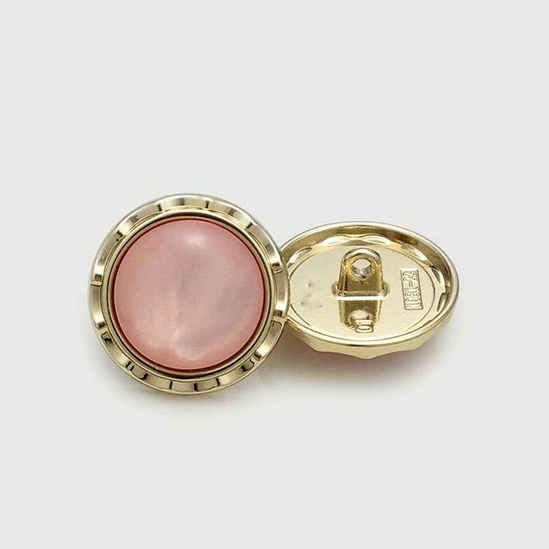 Round gold-tone metal shank buttons with pink cat’s-eye center, front and back