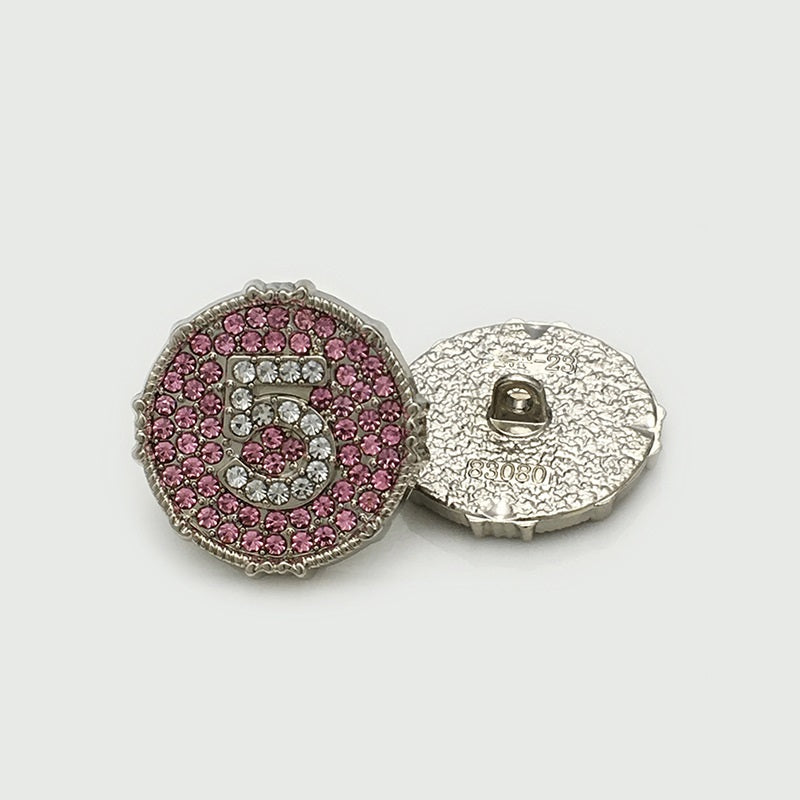 Round silvertone metal buttons: number 5 with pink rhinestones, front and back