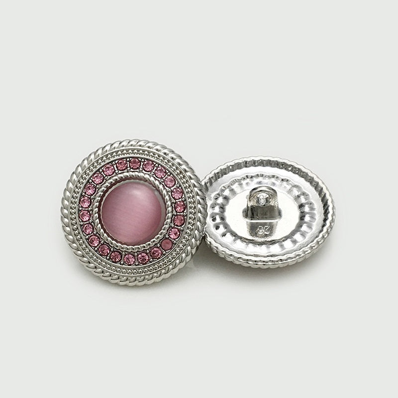 Round pink-silver metal shank buttons, lace design with rhinestone border, 2 shown