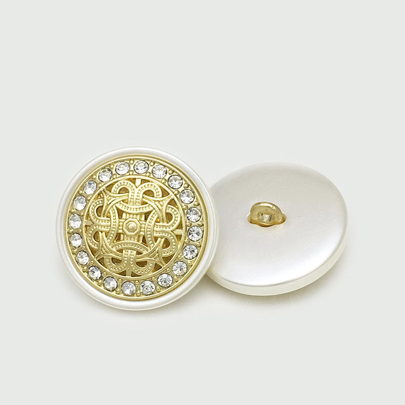 Gold-white resin shank button, gold filigree center, rhinestone border, back visible