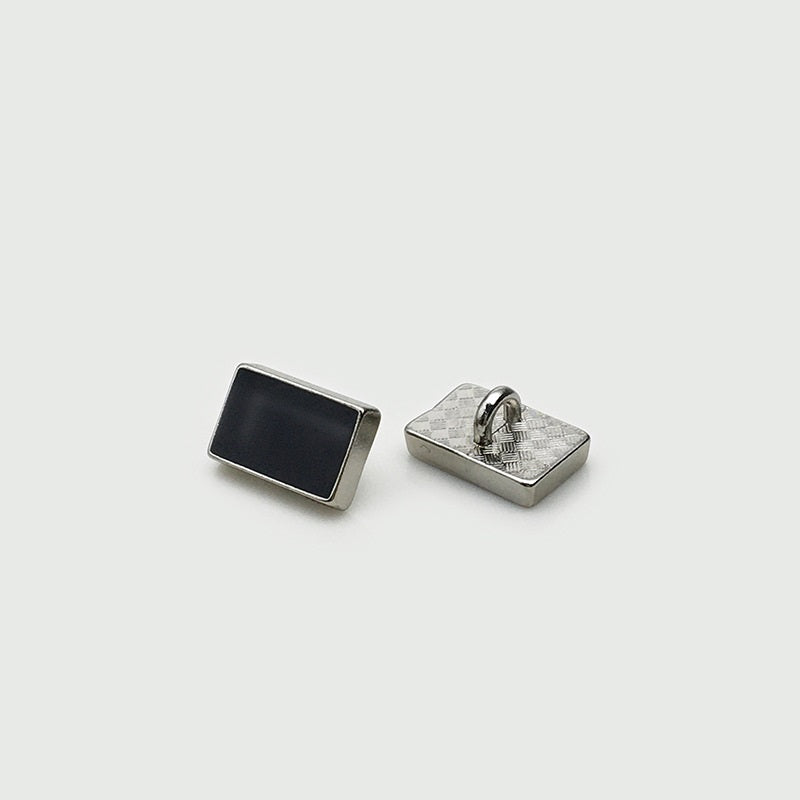 Rectangular shirt sewing button: black front with silver-tone back and shank