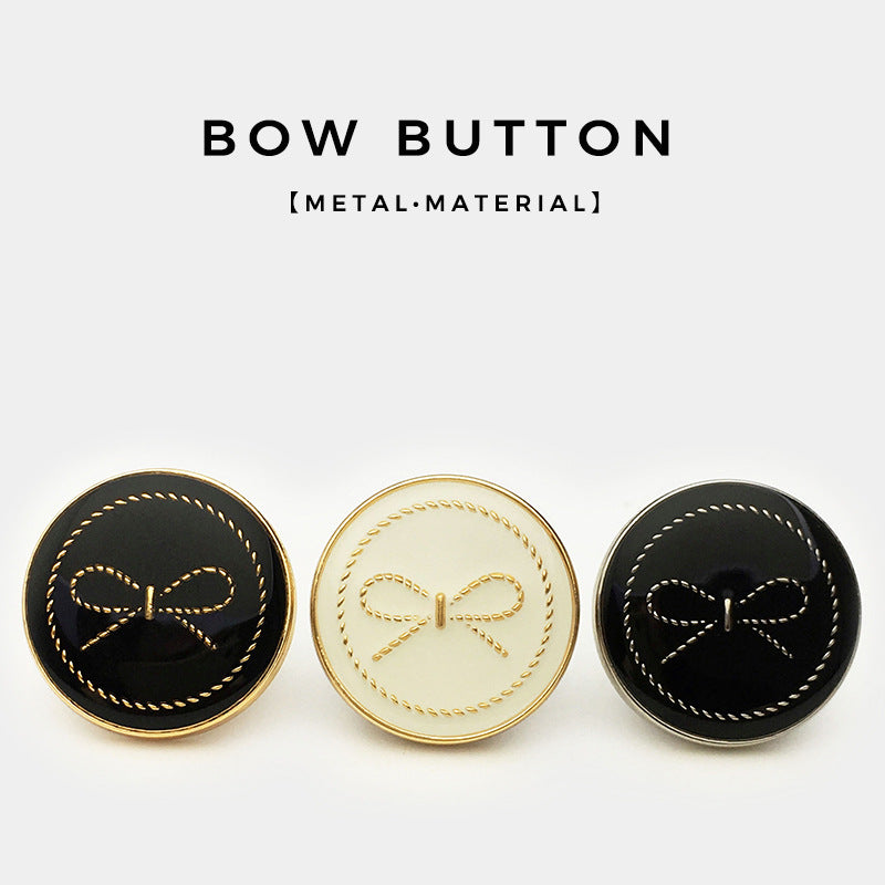 Set of round bow buttons: black, white, and dark with contrast metal rims and stitching