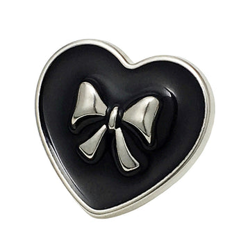 Black heart-shaped bow metal button, silver border and bow, front close-up