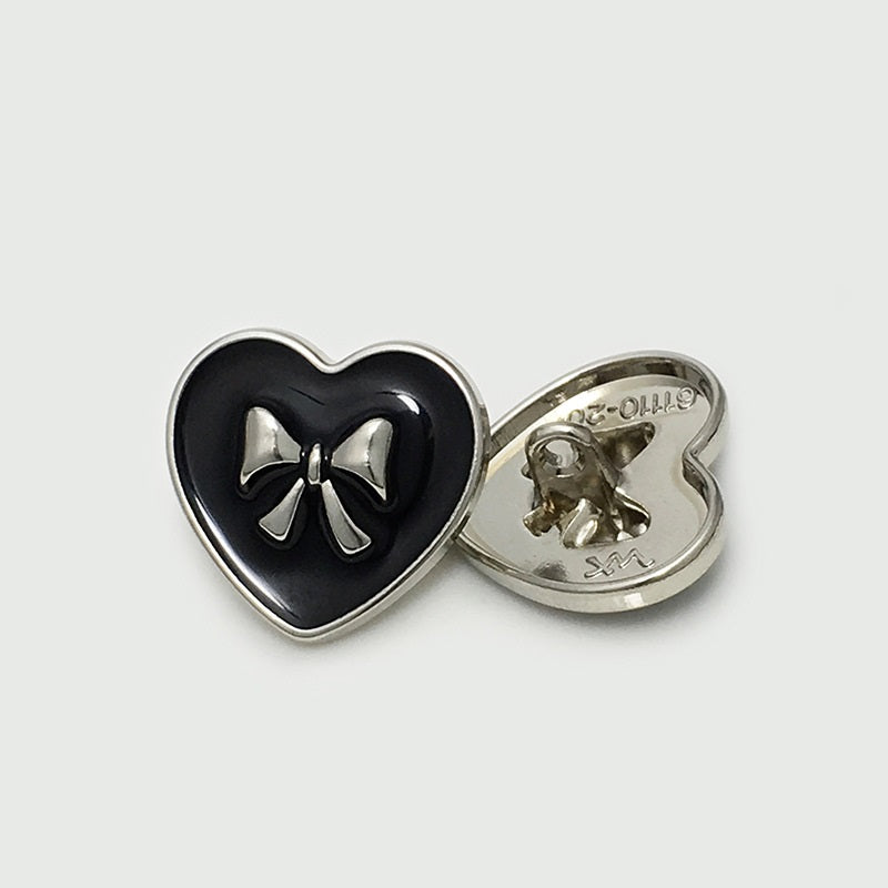 Black heart bow metal button with silver-tone bow, back side and front together