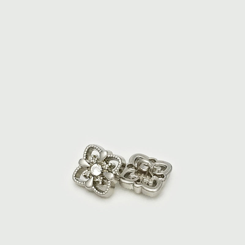 Silver square hollow metal button with rhinestone flower center and diamond shank