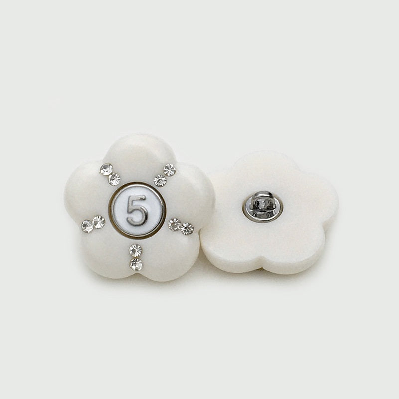White resin flower button with number 5 panel and rhinestones; matching back
