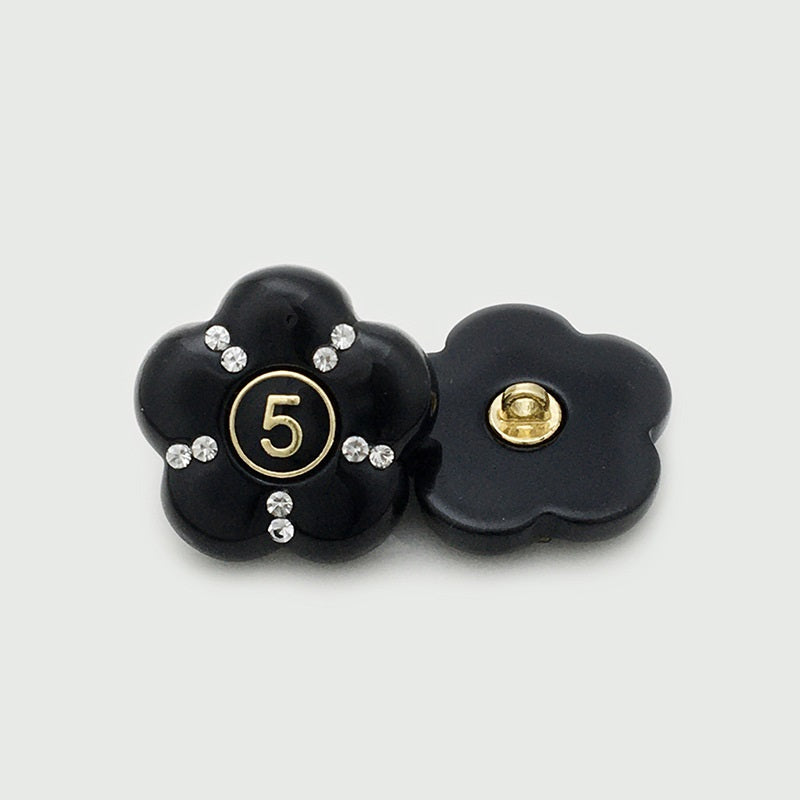 Black resin flower button with number 5 and rhinestones; reverse metal loop