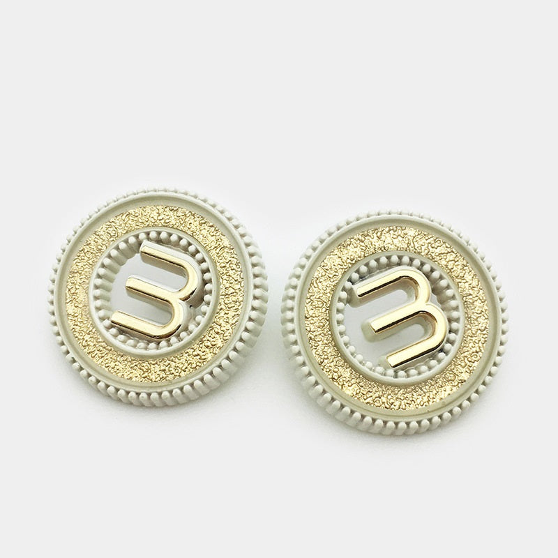 Two ivory hollow metal buttons with letter M, gold textured face, shank