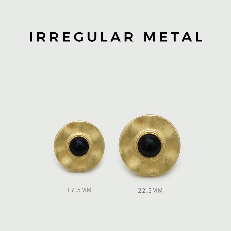 Pair of irregular round gold buttons: black centers, 17.5mm and 22.5mm