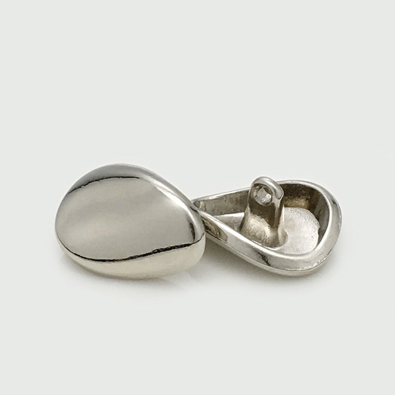Silver irregular metal button with shank, domed face and metal loop stem