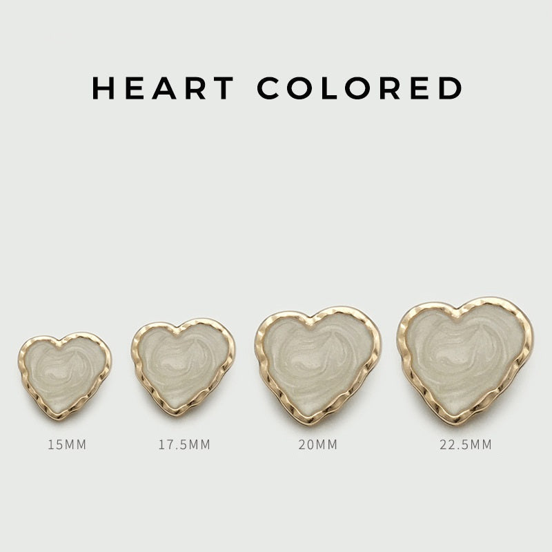 Heart-shaped enamel metal buttons in white, showing sizes 15mm to 22.5mm