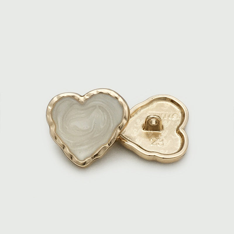 Heart-shaped enamel metal button back, white front, gold-tone with 1-hole prong