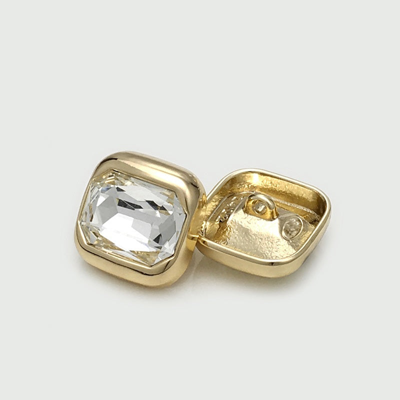 Gold square crystal button, back view with two holes and clear faceted gem