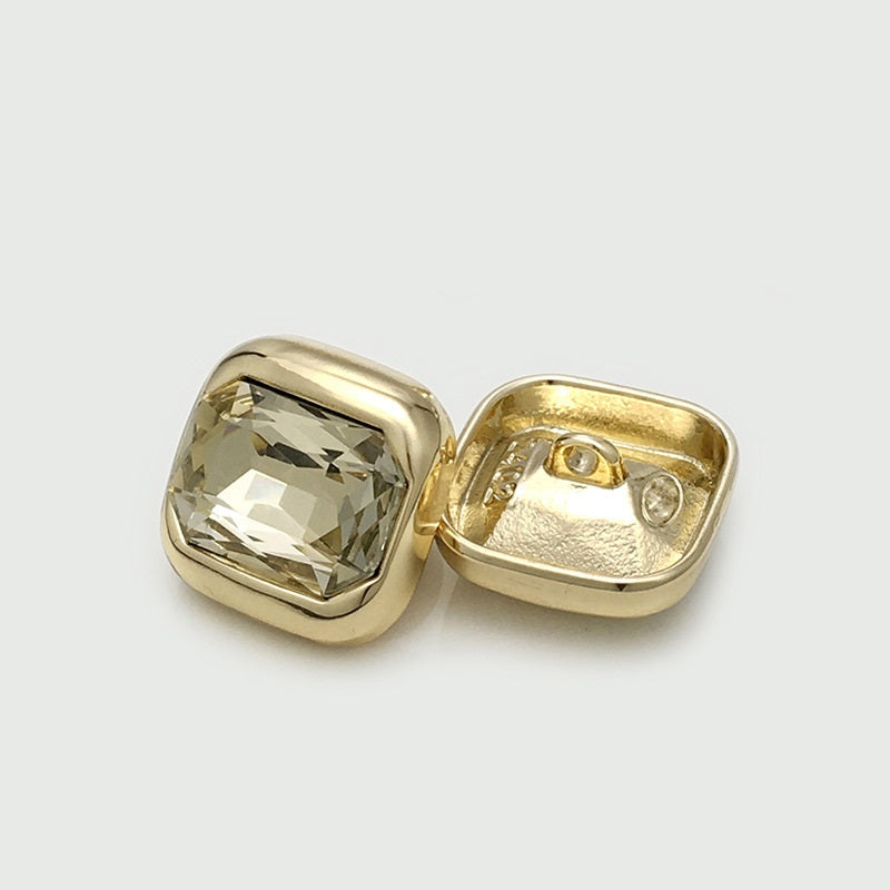 Gold/champagne square crystal button, back view with two holes and faceted gem