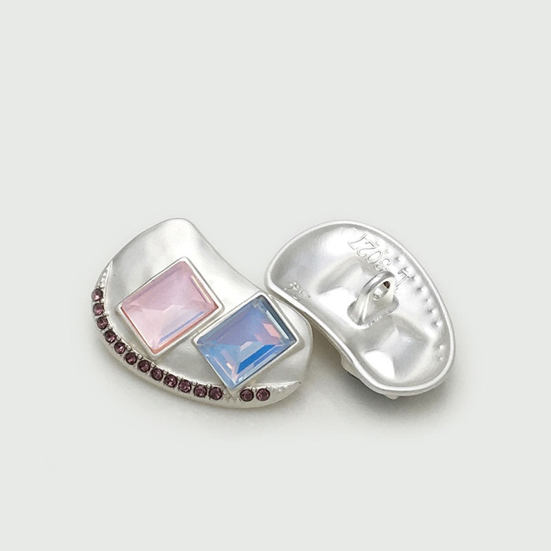 Irregular metal buttons, silver tone pair with pink and blue square stones