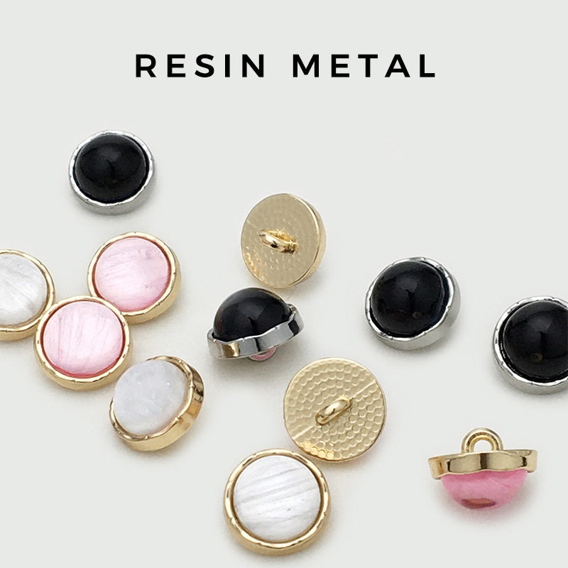 Set of round metal shirt buttons with resin-like pearlized centers in dark, pink, white
