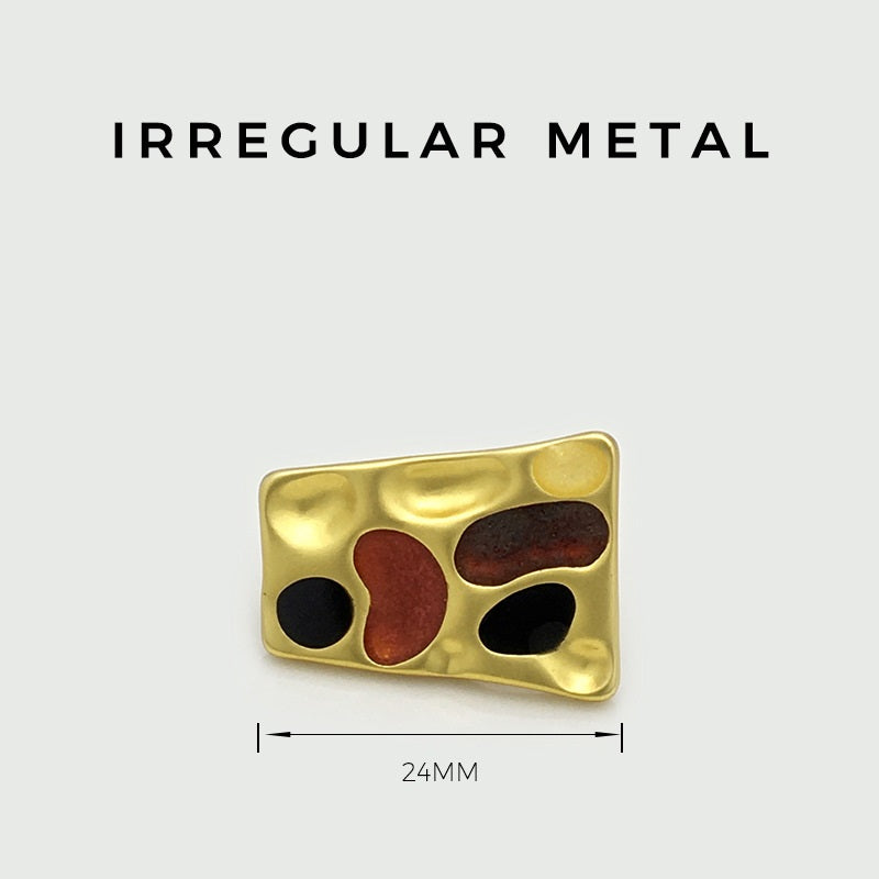24mm trapezoidal metal button, gold tone front with black and red-brown insets