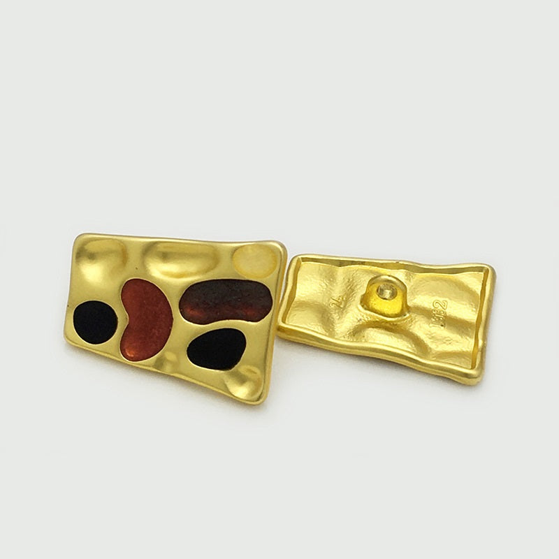Gold tone trapezoidal metal buttons: front view and back with shank cap