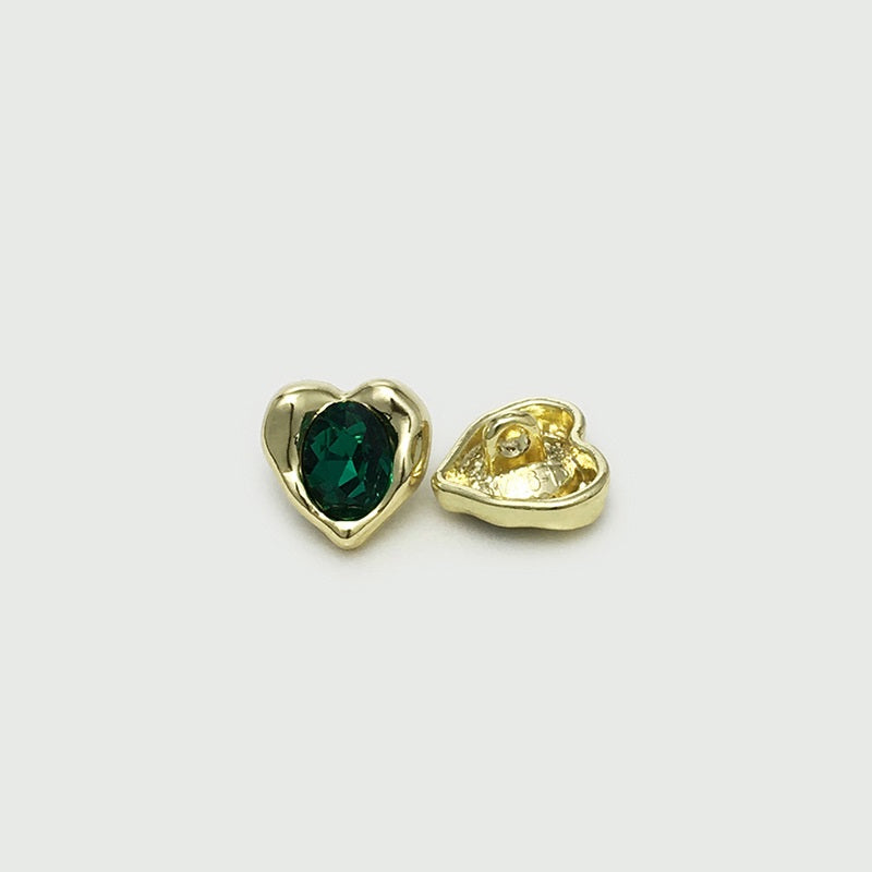 Gold-tone heart cuff button with green gem, shown front and reverse