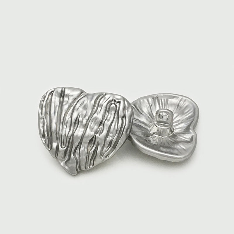 Silver heart-shaped metal button with vertical stripes and back loop hole