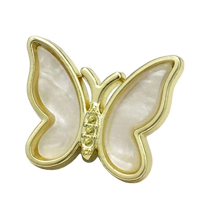 White 3D butterfly metal button with gold-tone rim and pearl-like center