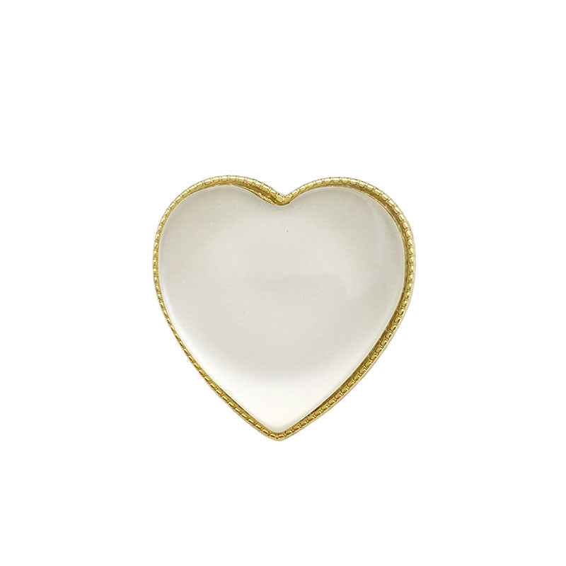 Heart-shaped decorative button with opal-look center and gold-tone metal frame