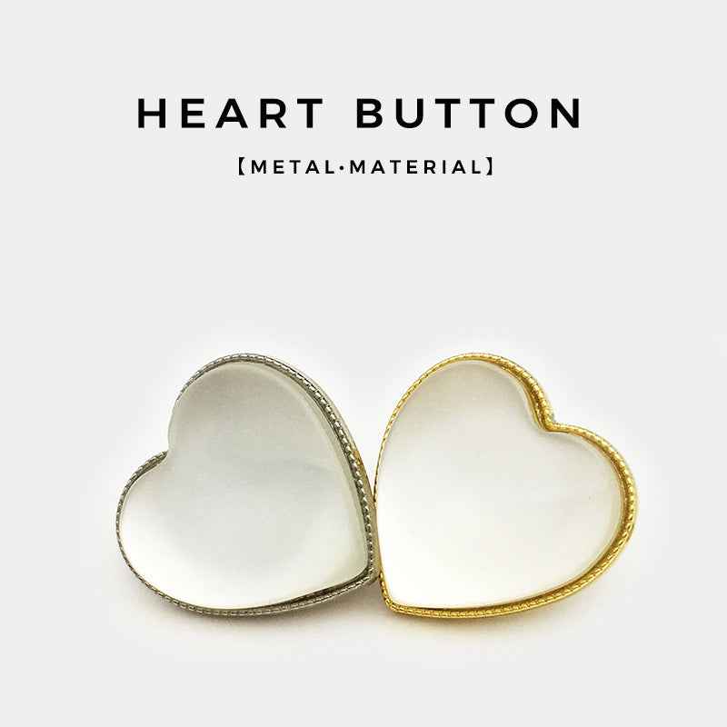 Two heart-shaped opal-look decorative buttons, silver-tone and gold-tone front