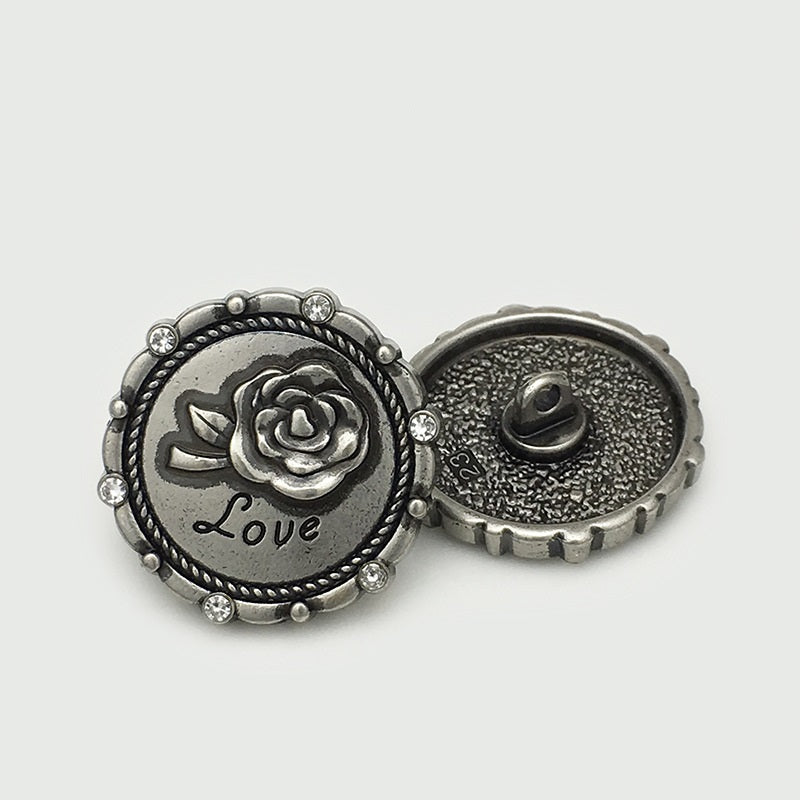 Antique silver LOVE rose button front with rhinestone rim and visible 2-hole back