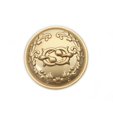 Antique gold circular metal button with wreath border and ornate center design