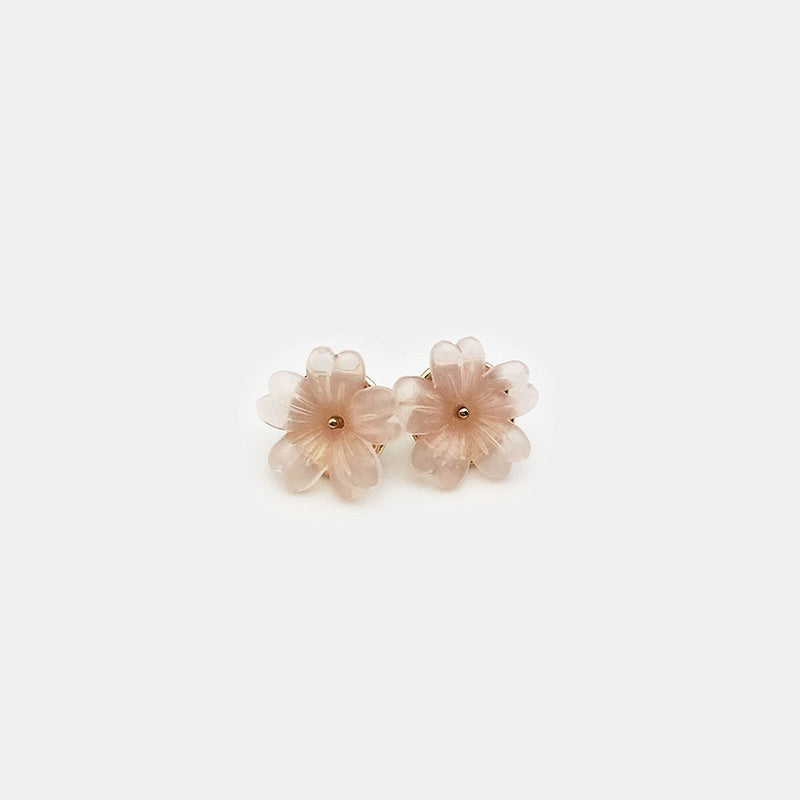 Pair of 11mm transparent floral resin shirt buttons, pale pink/peach petals