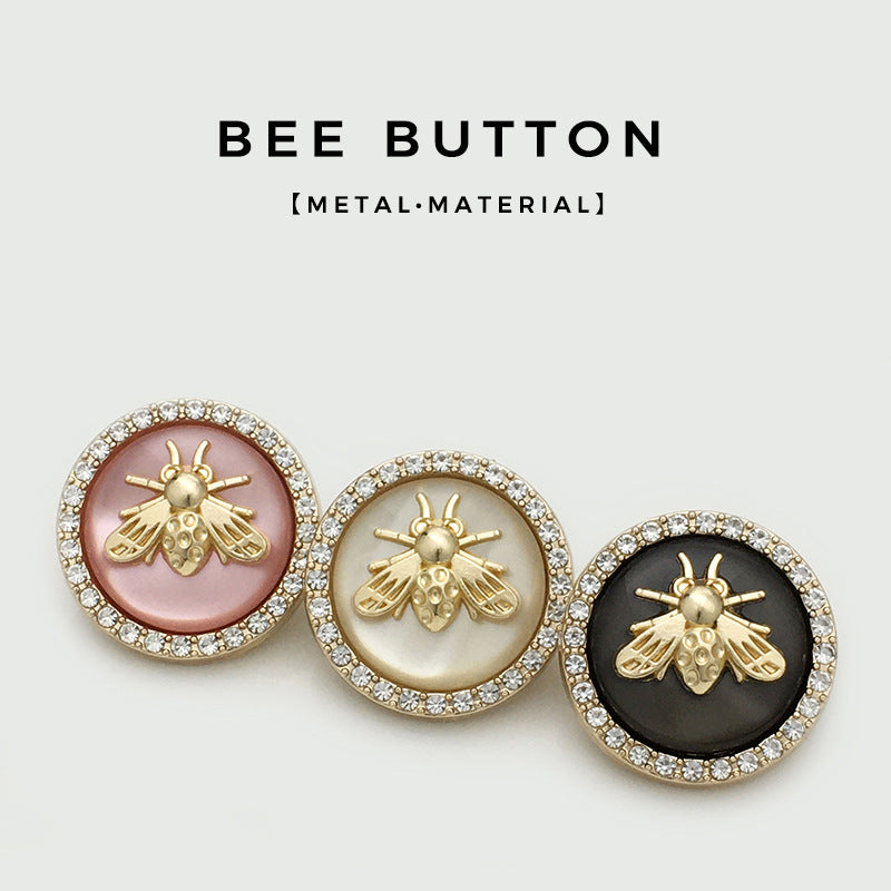 Bee metal buttons in pink, beige, and black, gold-tone bee motif with rhinestone rim