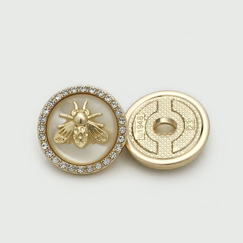 Beige bee metal button with rhinestone border; shows front and gold-toned back
