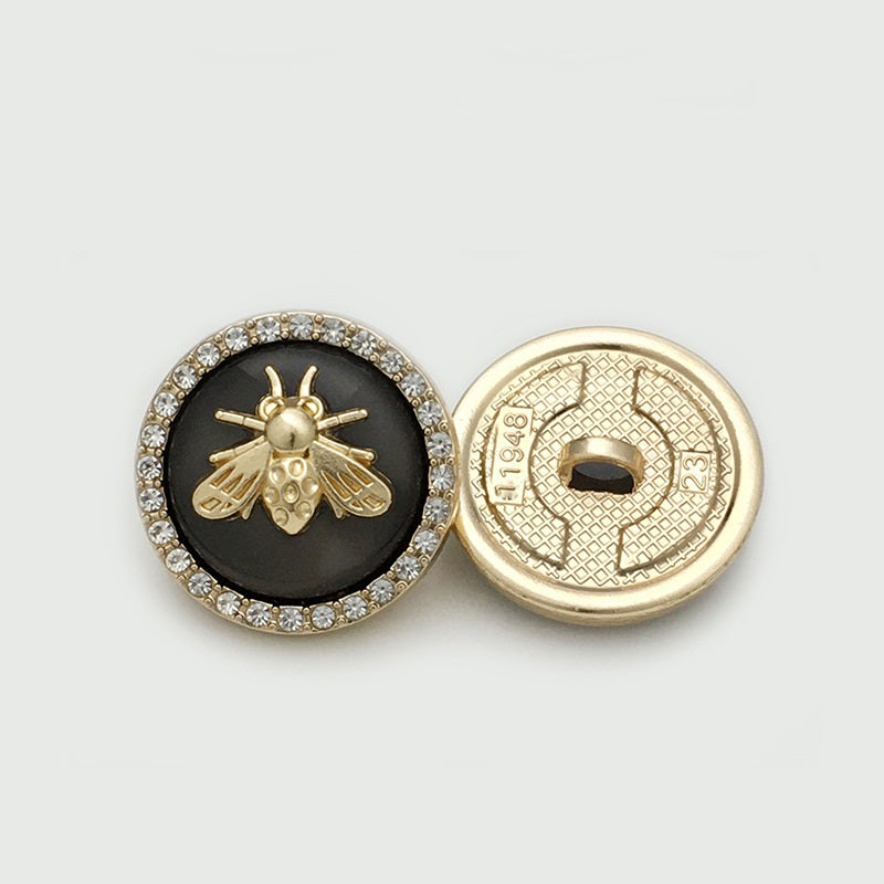 Black bee metal button with rhinestone border; shows front and gold-toned back