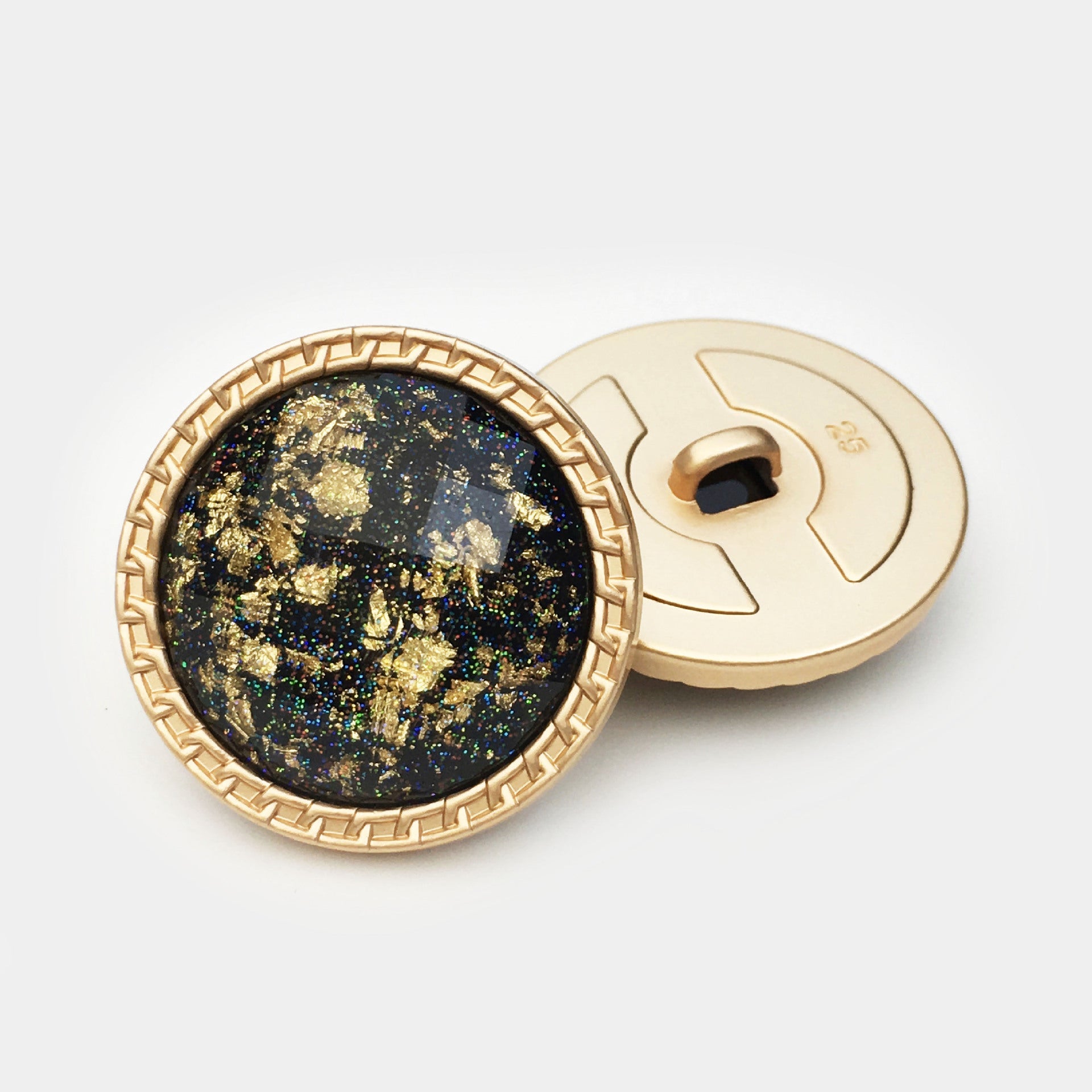 Dark navy/black 25mm gold foil water ripple resin button front with gold rim and back