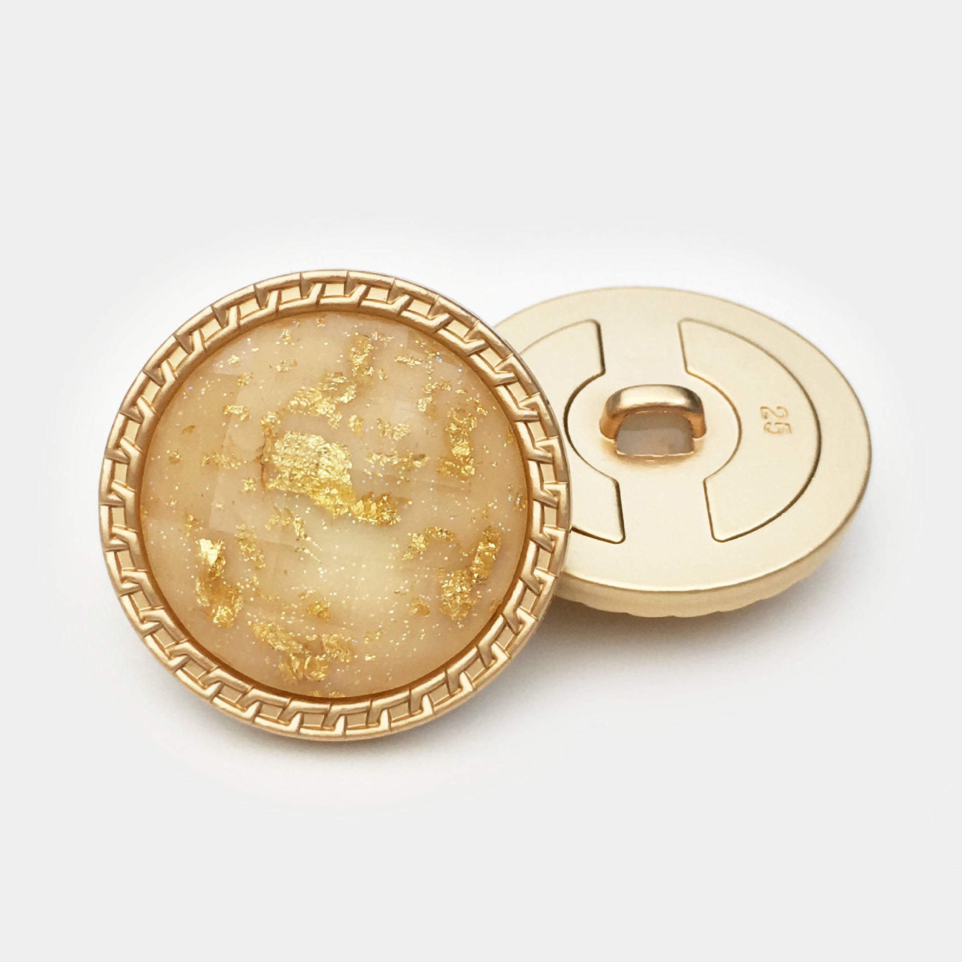 Yellow 25mm gold foil water ripple resin button front with gold rim and back