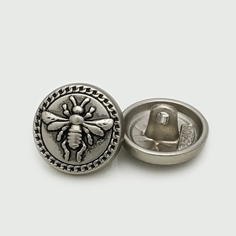 Antique Silver round metal bee button, front and back showing 4-hole base